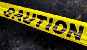 Yellow tape with the word "caution" on it in black letters.
