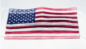 A medical mask with an American flag printed on it.