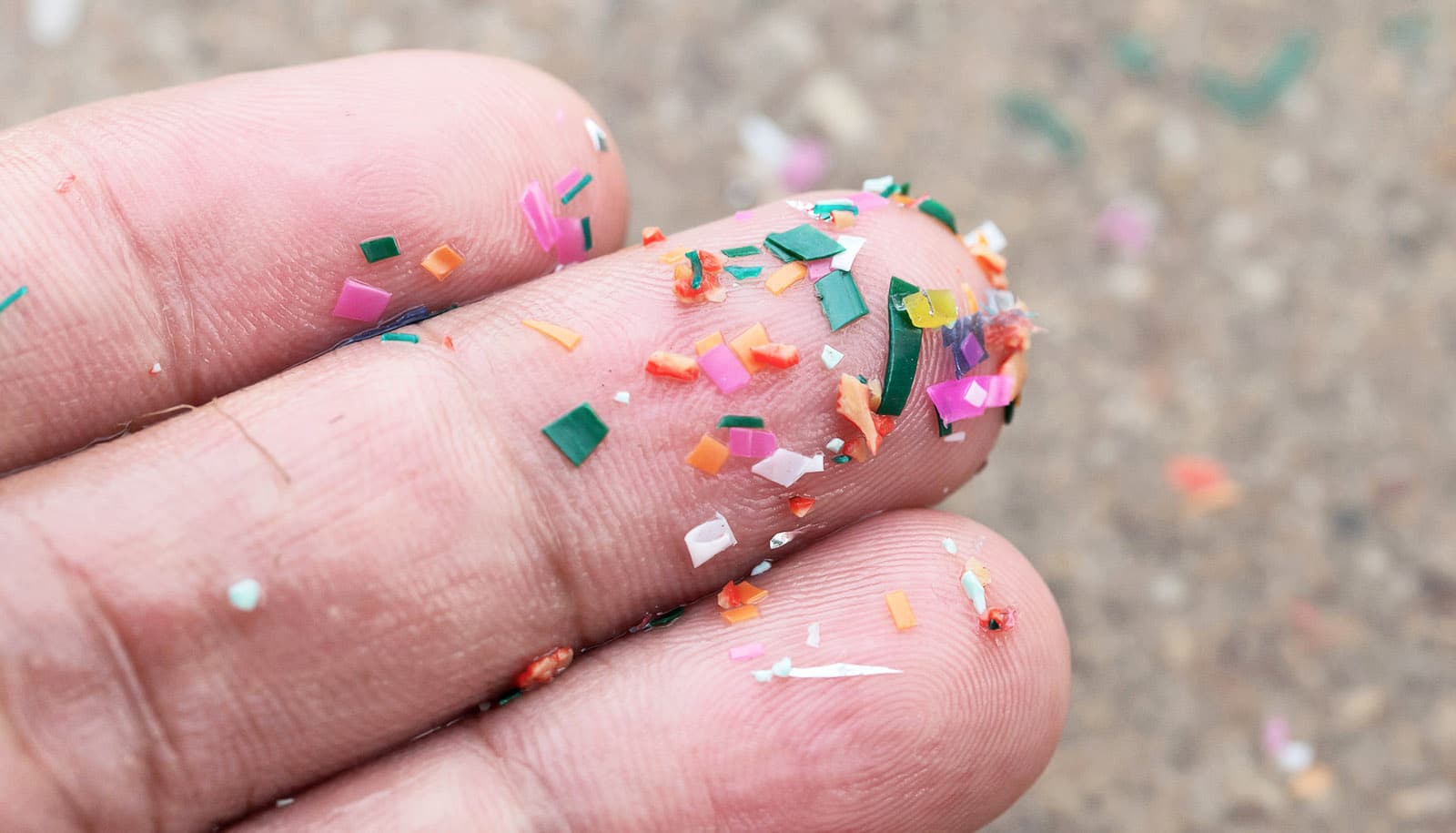 microplastic bits on fingers
