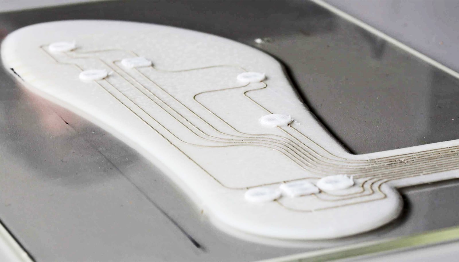 The insole has golden wires running through it.