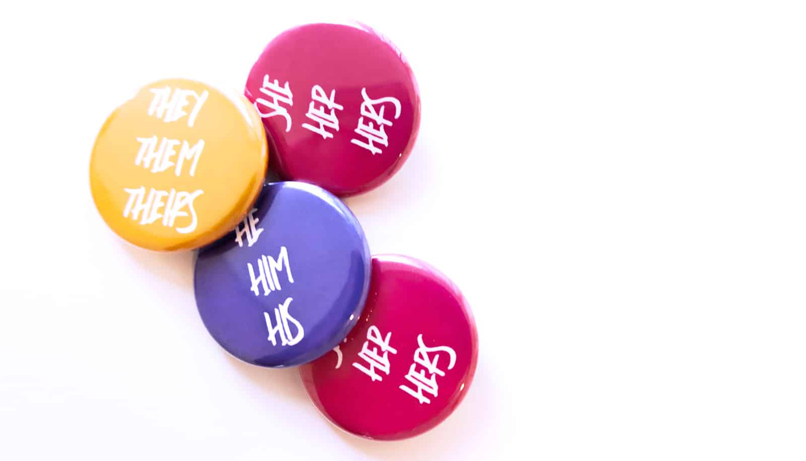 colorful pins with pronouns