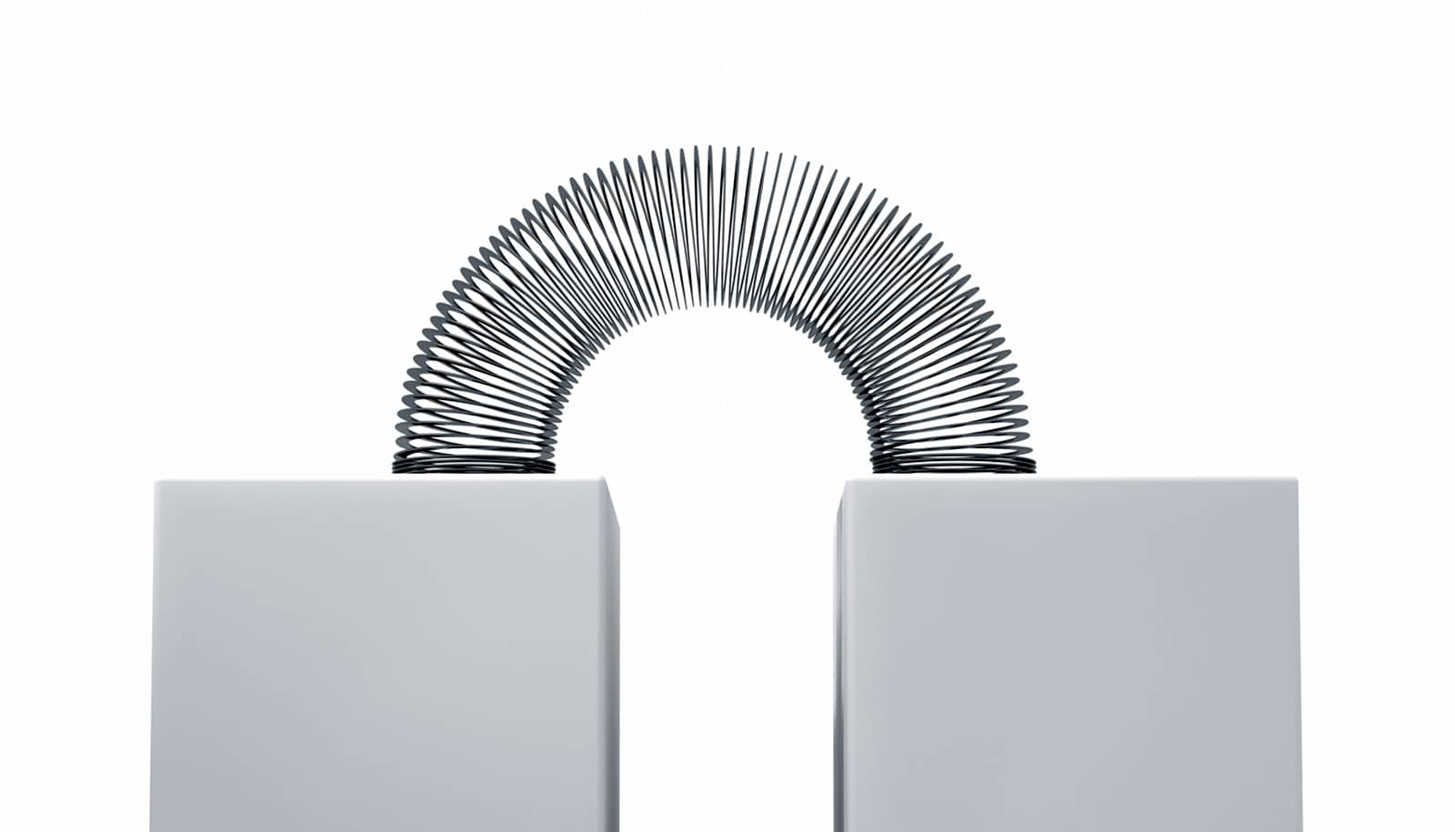 slinky arcs across two gray blocks