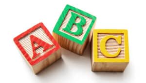 Wooden blocks with the letters A, B, and C on them.