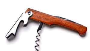 A bottle opener and corkscrew tool on a white background.