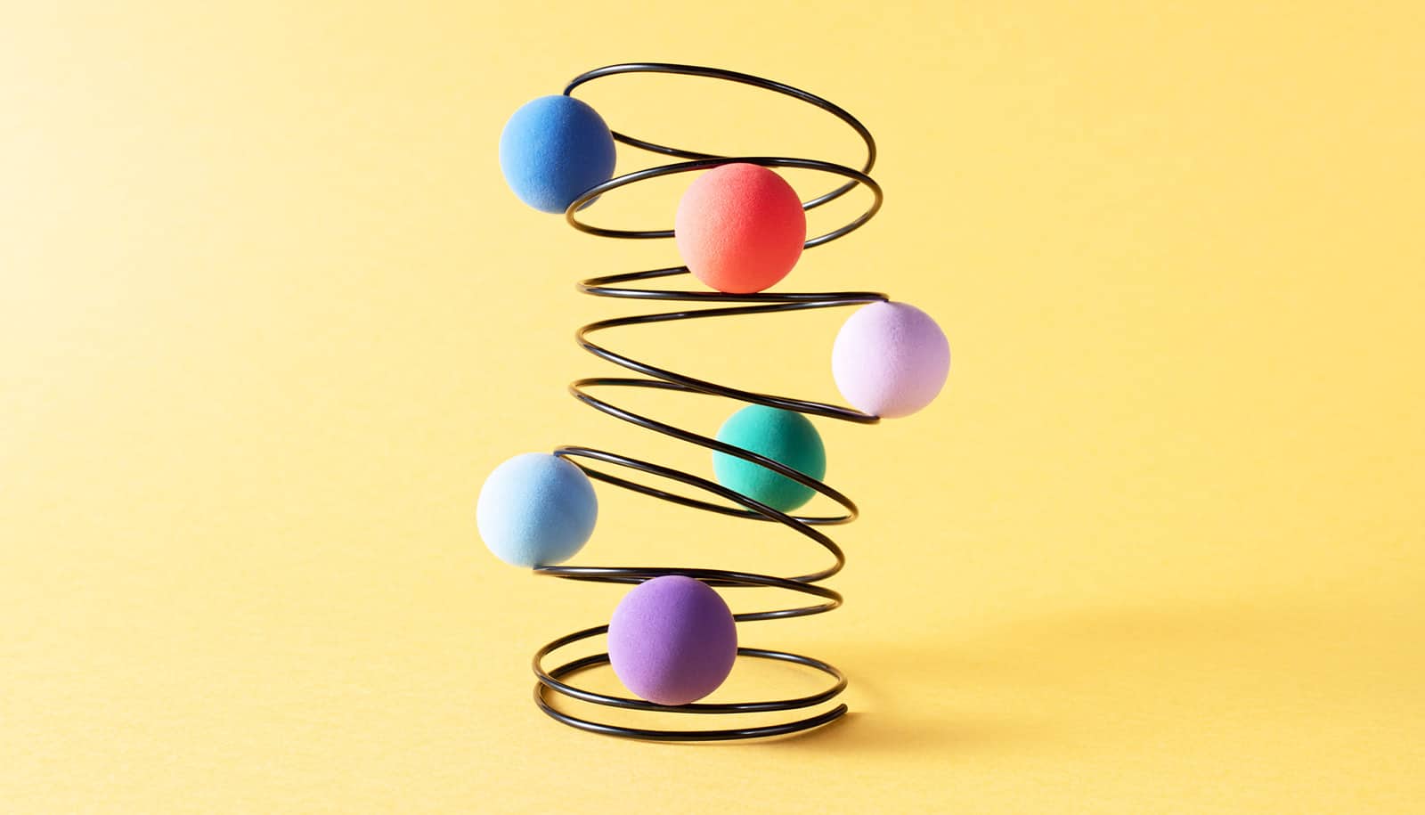 colorful spheres in wire spring