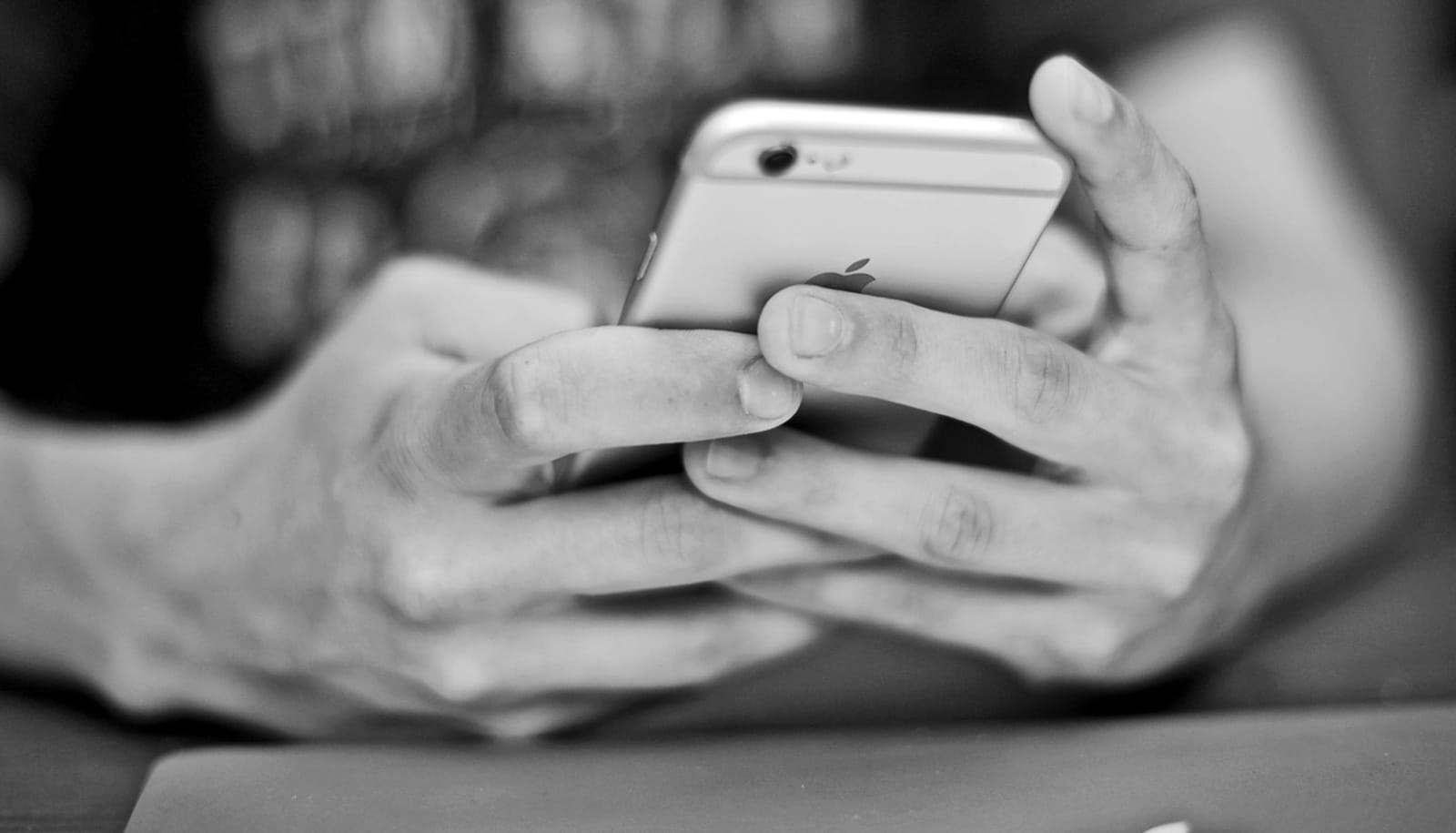 person holding iPhone person holding iPhone
