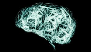 Smoke takes the shape of a brain on a dark background.