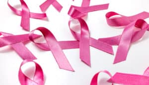 Several pink ribbons on a white background.