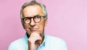 A man has a skeptical expression on his face.