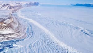 An arctic landscape with mountains on the left.