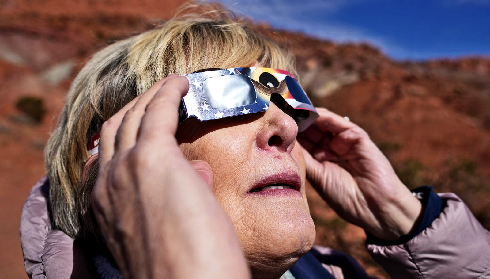 What is the scientific explanation for the safety of solar eclipse glasses?