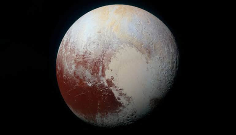 A shot of Pluto against the blackness of space shows the "heart" on its surface.