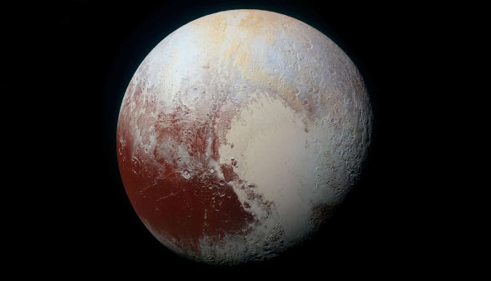 A shot of Pluto against the blackness of space shows the "heart" on its surface.
