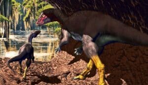 An adult and baby dinosaur walk towards the entrance of their underground dwelling.