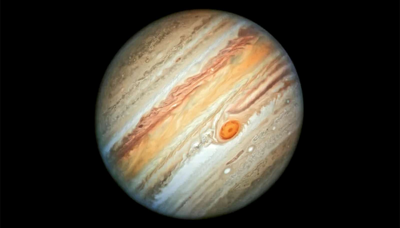 A shot of Jupiter shows its swirling spot on the southern hemisphere of the planet.