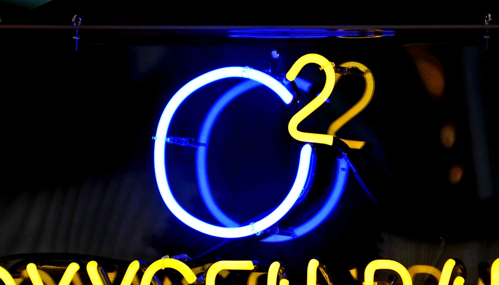 A neon sign reads "O2," the symbol for oxygen.