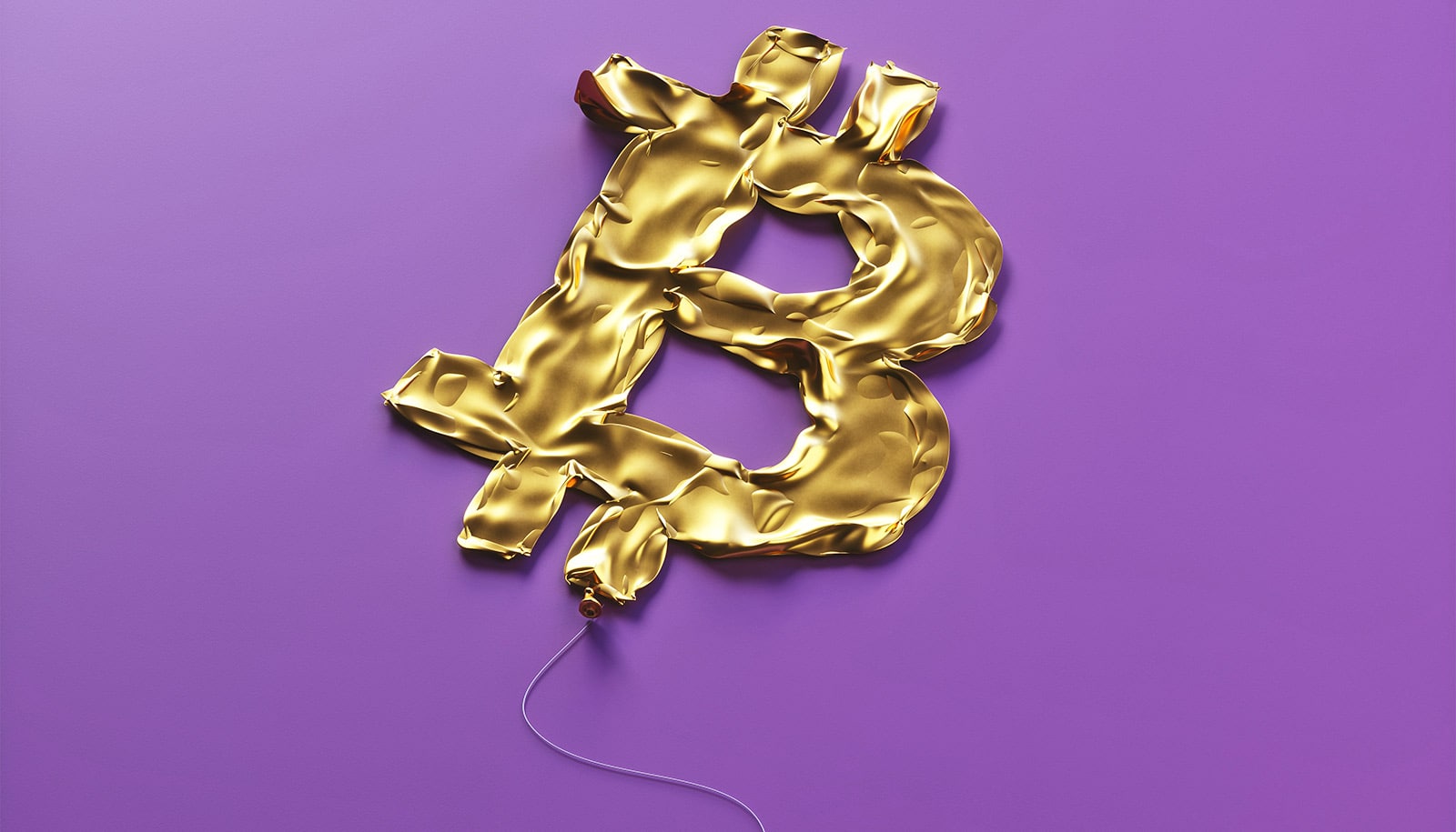 A balloon shaped like the BitCoin logo is deflated on a purple background.