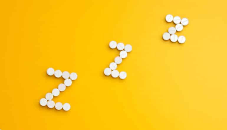 White pills for three Z's to indicate sleep.