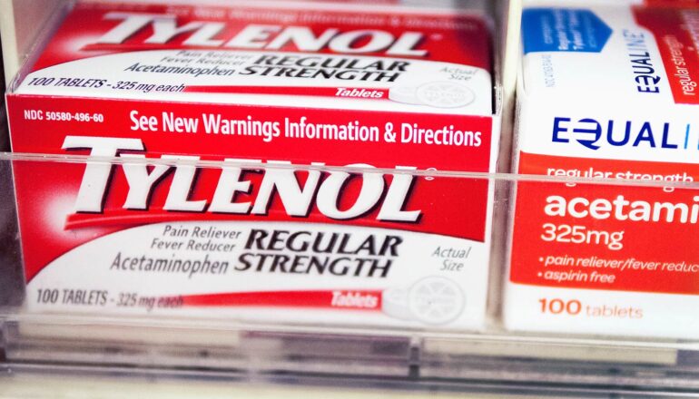 A box of Tylenol on a store shelf.