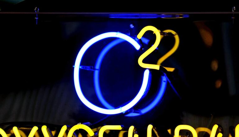 A neon sign reads "O2."