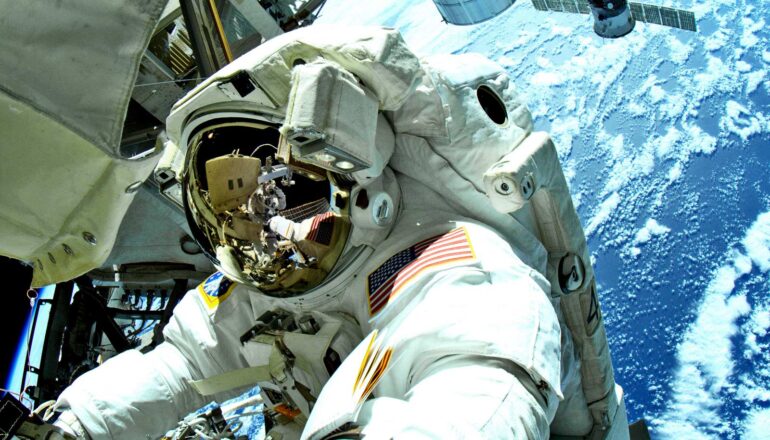An astronaut during a space walk outside the International Space Station.