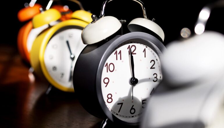 A row of alarm clocks.