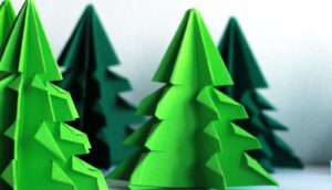 Green paper cutouts of Christmas trees.