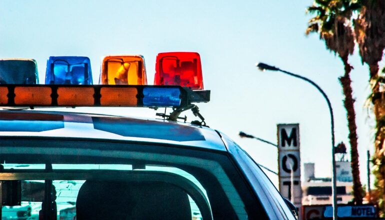 A police car's lights at daytime.