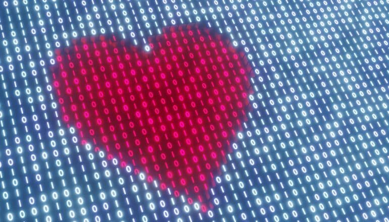 A heart image on a screen showing rows of zeroes and ones.