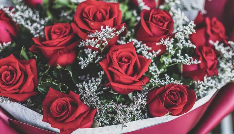A bouquet of roses and baby's breath.