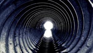 A tunnel with a light at the end.