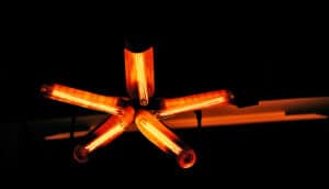 5 lamps on a ceiling are arranged in the shape of a star.