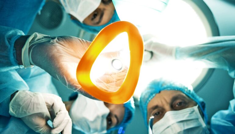 Surgeons giving anesthesia.