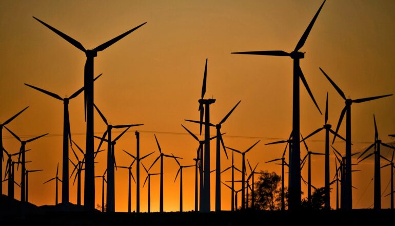 Wind turbines at sunset.