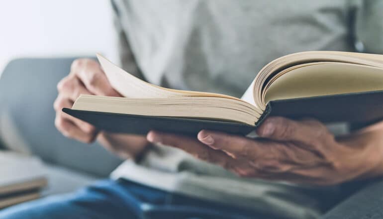 A man reads a book.