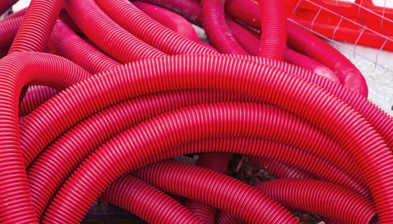 Red tubes coiled on top of each other.
