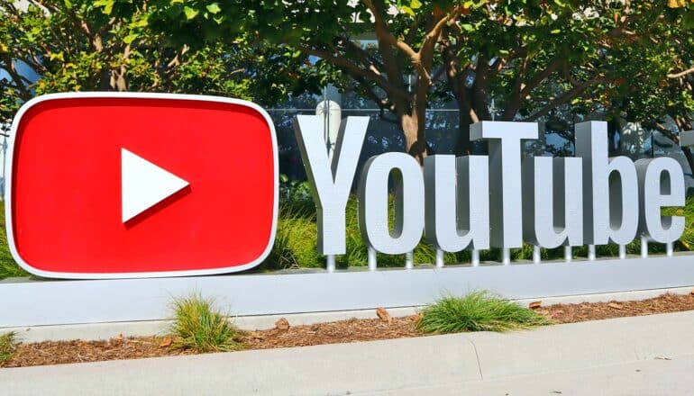 A sign outside the YouTube theater reads "Youtube" and has the company's red video logo.